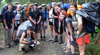 Student Hiking in Rain Gear
