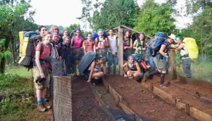 A group of Outward Bound students engage in community service, learning compassion through experience.